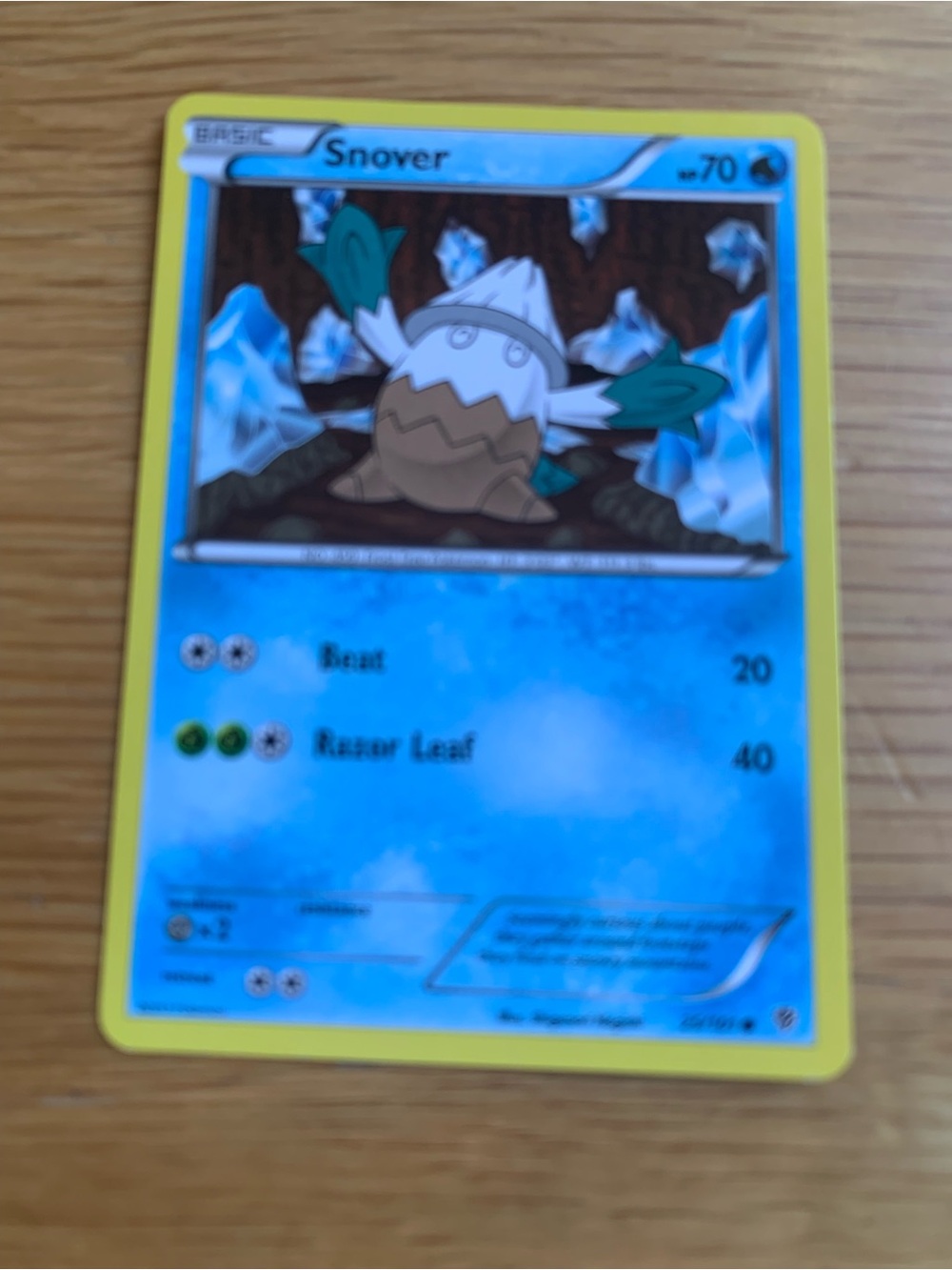 Trading Card on Wooden Surface